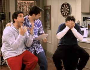 Still from Friends episode "The One with  the Baby Shower" featuring Ross, Joey, and Chandler playing Bamboozled